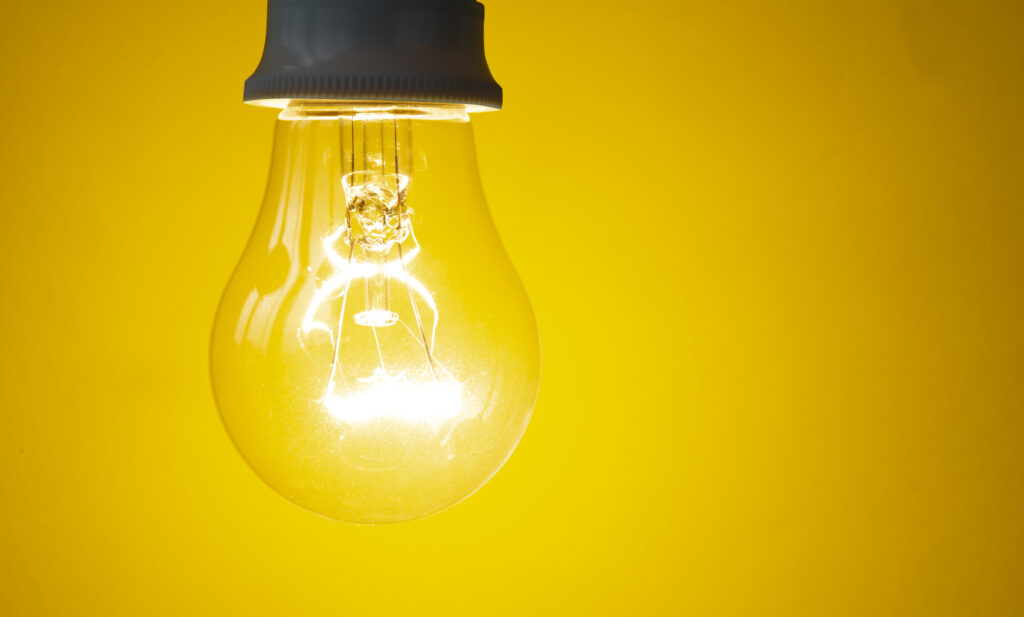 Light bulb on yellow background.